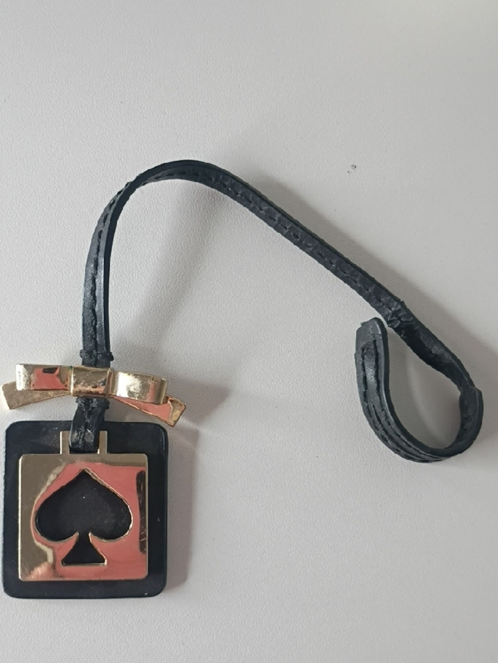 Kate Spade New York bag charm Poker Spade with Golden Bow
